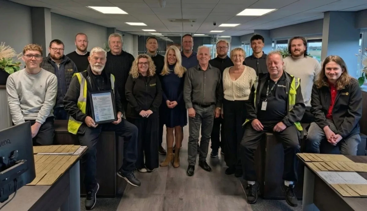 The Universal Forwarding team inside their office.